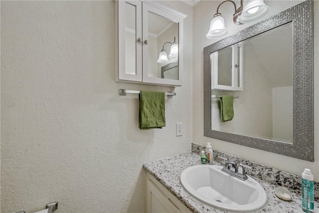 1902 Dartmouth St Unit O2, College Station, TX 77840 - bathroom featuring a textured wall and vanity