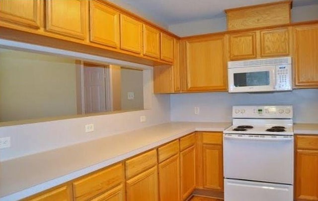 kitchen with white appliances and tile patterned floors