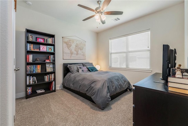 carpeted bedroom with ceiling fan