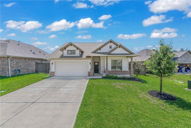 view of front of property featuring a front yard and a garage