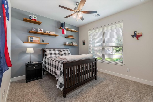 carpeted bedroom featuring ceiling fan