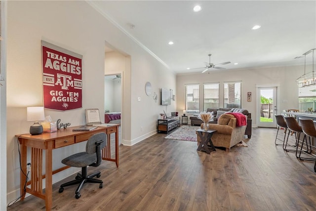 living room featuring ceiling fan, dark hardwood / wood-style flooring, and crown molding