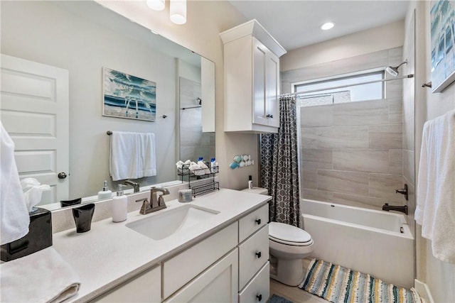 full bathroom with shower / bath combo, toilet, and vanity