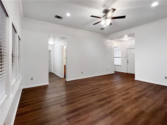 spare room with ceiling fan, dark hardwood / wood-style flooring, and ornamental molding