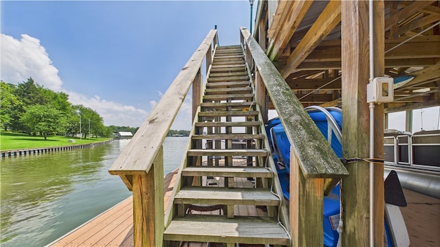 stairway featuring a water view