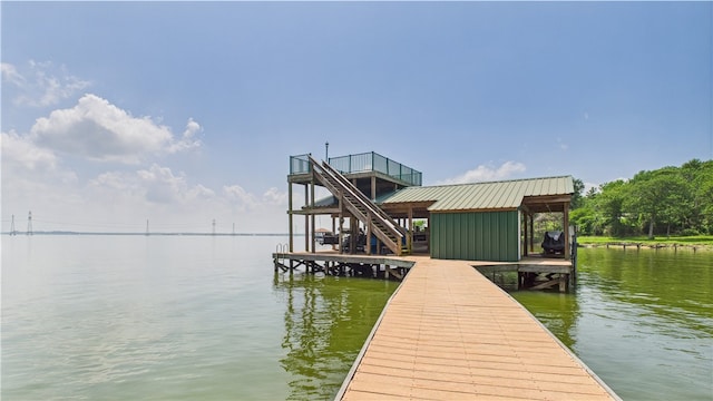 view of dock featuring boat lift and a water view