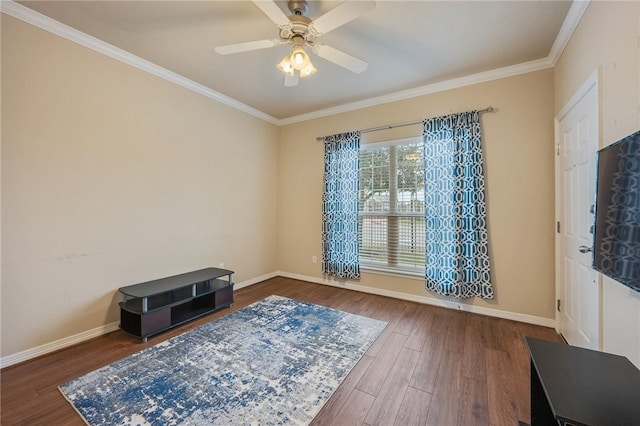 interior space with wood-type flooring, ornamental molding, and ceiling fan