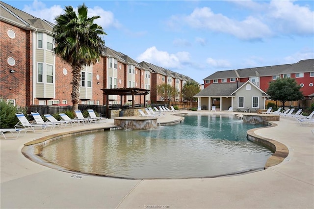 view of pool featuring a patio and pool water feature