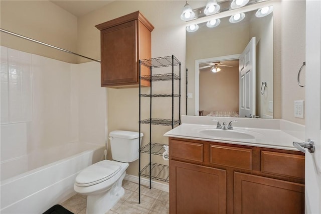 full bathroom featuring ceiling fan, tile patterned flooring, vanity, bathtub / shower combination, and toilet