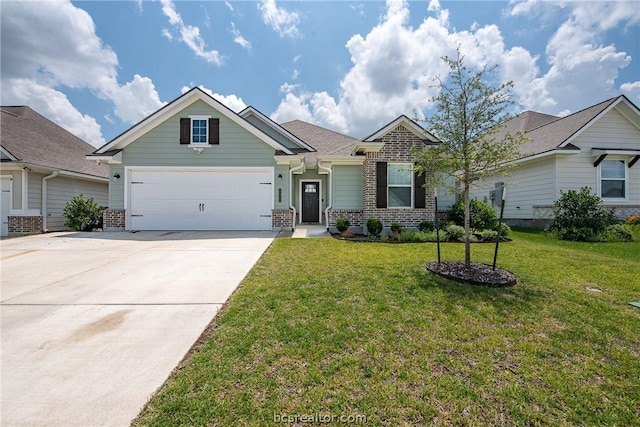 view of front of property featuring a garage and a front lawn