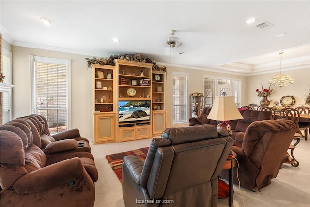 4718 Stonebriar Cir, College Station, TX 77845 - living room featuring light colored carpet, ornamental molding, a fireplace, and an inviting chandelier