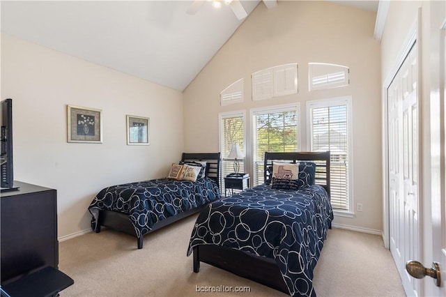4718 Stonebriar Cir, College Station, TX 77845 - carpeted bedroom with ceiling fan, a closet, and high vaulted ceiling