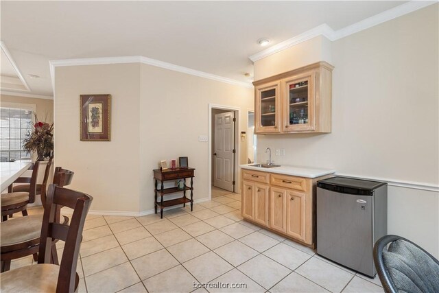 4718 Stonebriar Cir, College Station, TX 77845 - kitchen with crown molding, sink, light brown cabinetry, light tile patterned flooring, and stainless steel refrigerator
