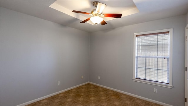 unfurnished room featuring baseboards and ceiling fan