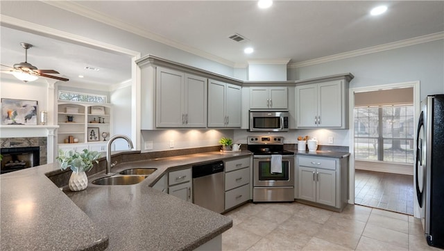 kitchen featuring a sink, dark countertops, and appliances with stainless steel finishes