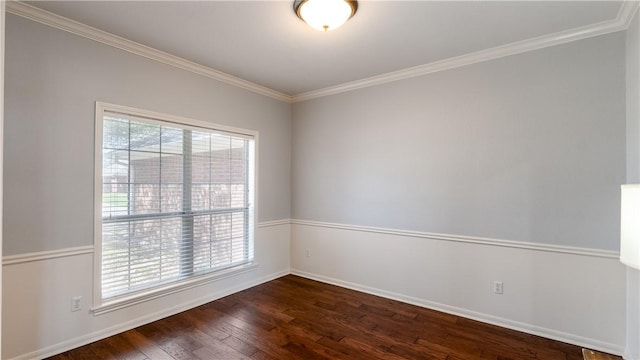 unfurnished room featuring dark wood-type flooring, crown molding, and a wealth of natural light