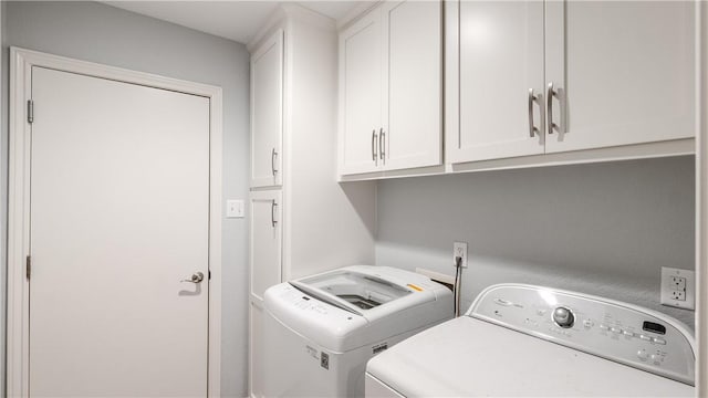 laundry area featuring cabinet space and washing machine and dryer