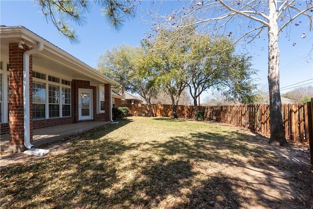 view of yard featuring a patio and a fenced backyard