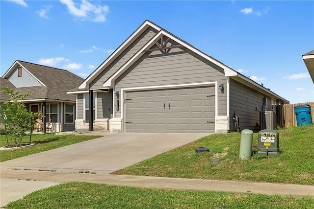 view of front of property with a garage, a front lawn, and concrete driveway