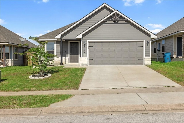 view of front of home with an attached garage, a front yard, and concrete driveway