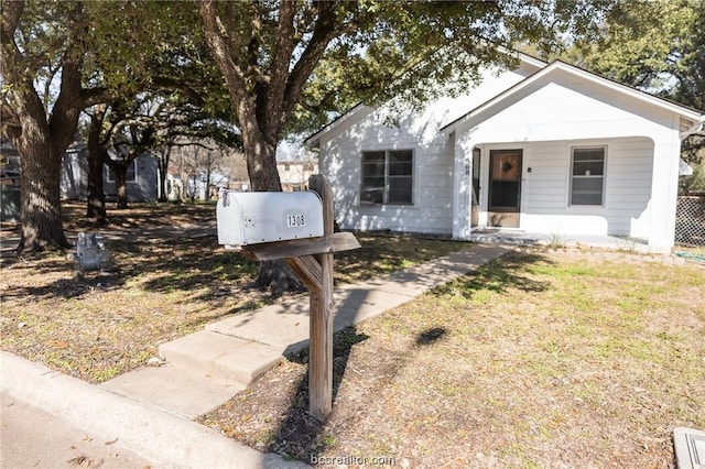 view of front of house featuring a front lawn and a porch