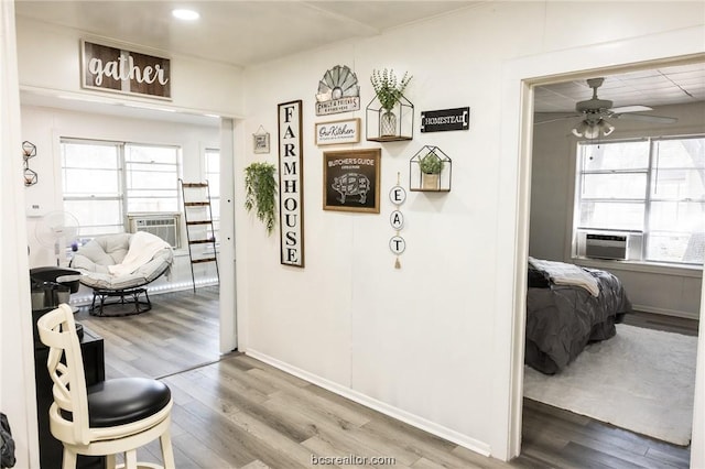 hall featuring hardwood / wood-style floors and cooling unit