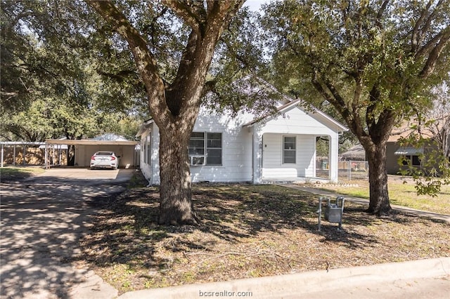 view of front of property with a carport and a porch