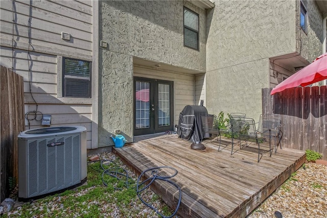 wooden deck with french doors, central AC, and grilling area