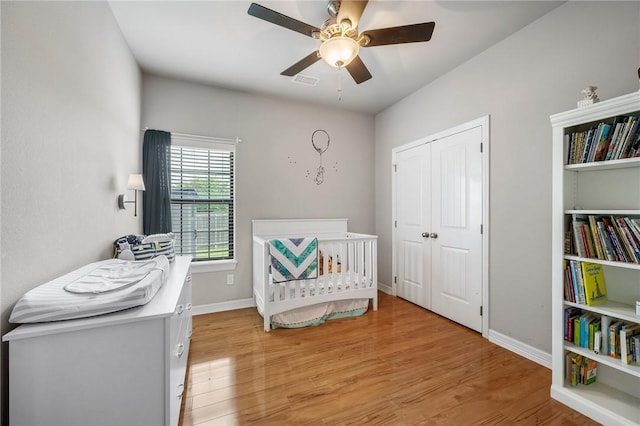 3901 Lienz Ln, College Station, TX 77845 - bedroom featuring light wood finished floors, baseboards, ceiling fan, and a closet