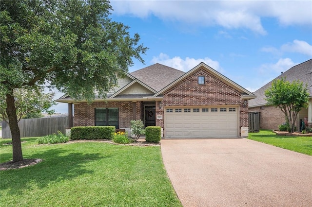 3901 Lienz Ln, College Station, TX 77845 - view of front facade with brick siding, an attached garage, concrete driveway, and roof with shingles
