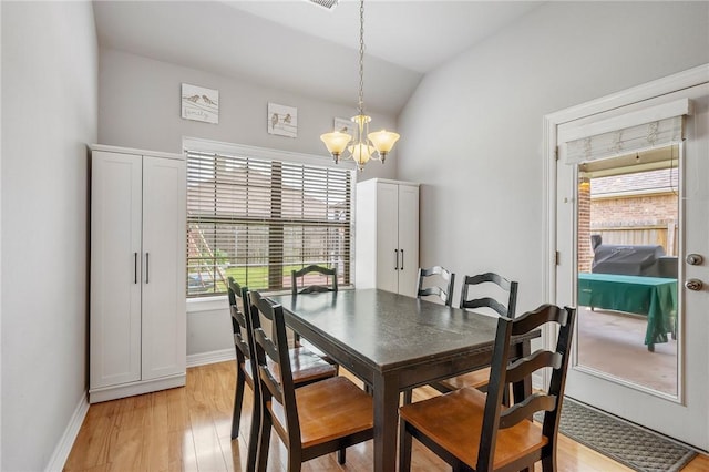 3901 Lienz Ln, College Station, TX 77845 - dining space featuring a chandelier, light wood-style flooring, lofted ceiling, and baseboards