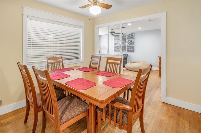 dining area featuring ceiling fan and light wood-type flooring