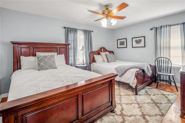 bedroom featuring light hardwood / wood-style floors and ceiling fan