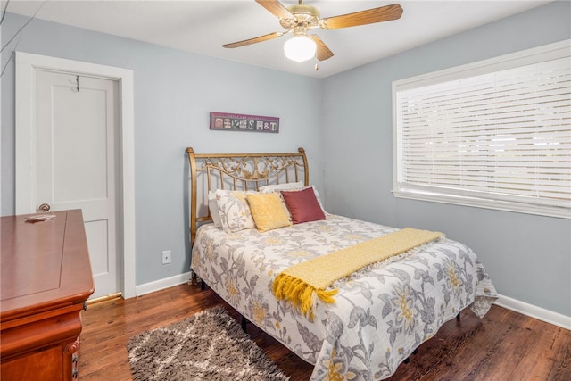 bedroom featuring ceiling fan and dark hardwood / wood-style flooring