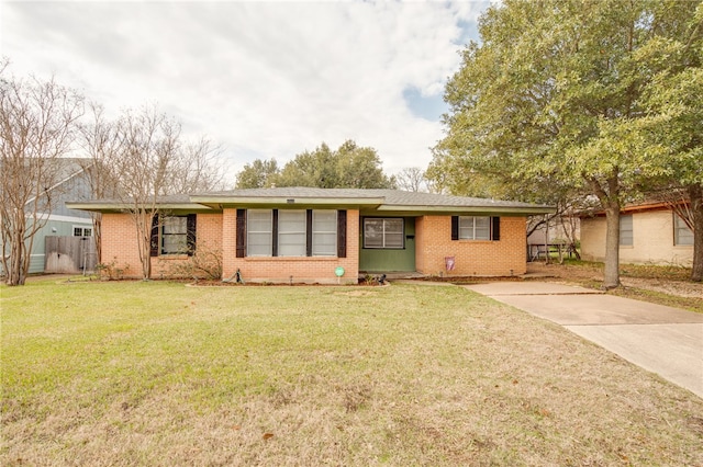 ranch-style home with a front yard