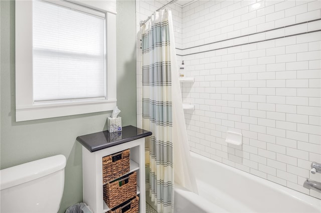 bathroom with toilet and shower / bath combo