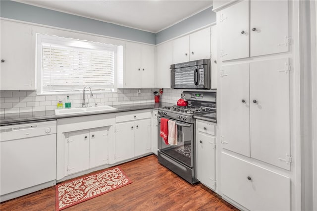 kitchen with white cabinetry, white dishwasher, and gas stove