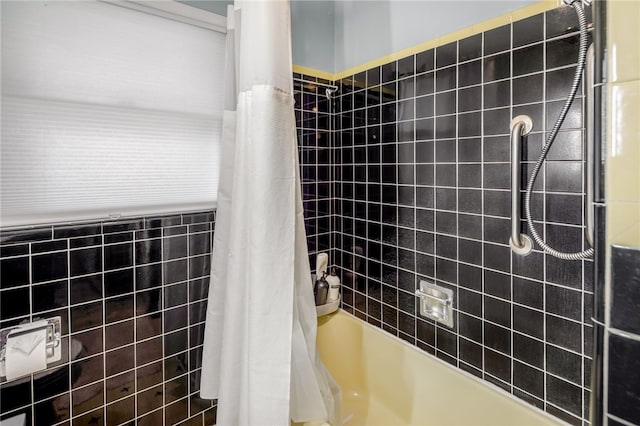 bathroom featuring shower / tub combo with curtain