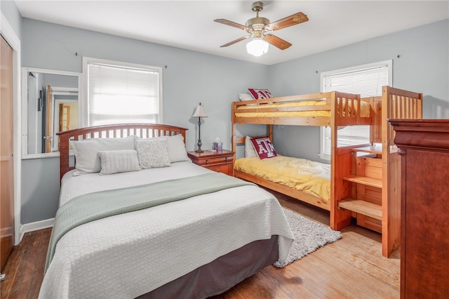 bedroom with hardwood / wood-style flooring and ceiling fan