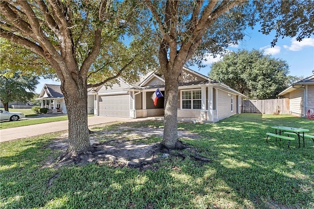 view of front of house featuring a garage and a front lawn