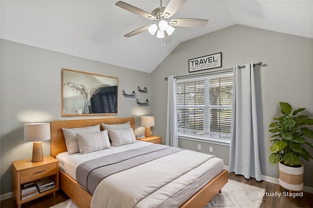 bedroom with hardwood / wood-style flooring, ceiling fan, and lofted ceiling