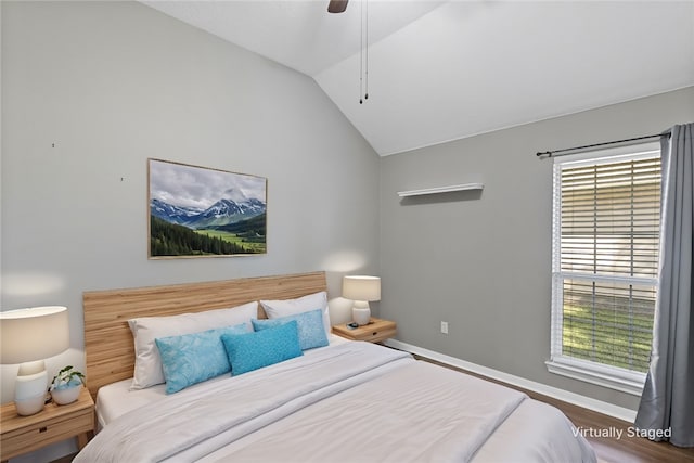 bedroom featuring ceiling fan, wood-type flooring, and lofted ceiling