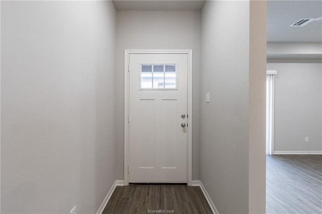 entryway with dark hardwood / wood-style flooring