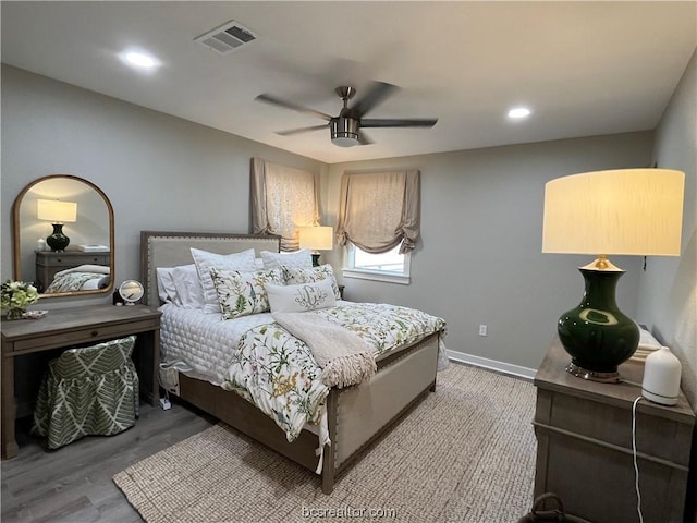 bedroom featuring ceiling fan and wood-type flooring