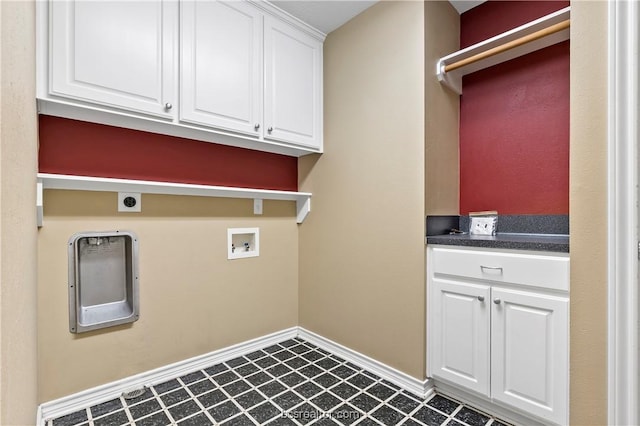 clothes washing area featuring hookup for an electric dryer, hookup for a washing machine, and cabinets