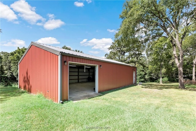 view of outbuilding featuring a yard