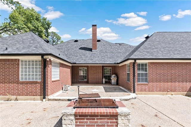 rear view of property with a patio