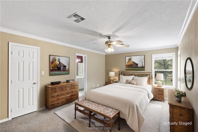 bedroom featuring ceiling fan, a textured ceiling, connected bathroom, and light carpet