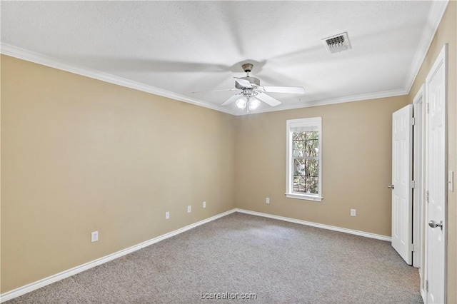 empty room with light carpet, a textured ceiling, ceiling fan, and crown molding