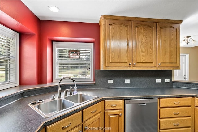 kitchen with dishwasher, tasteful backsplash, and sink